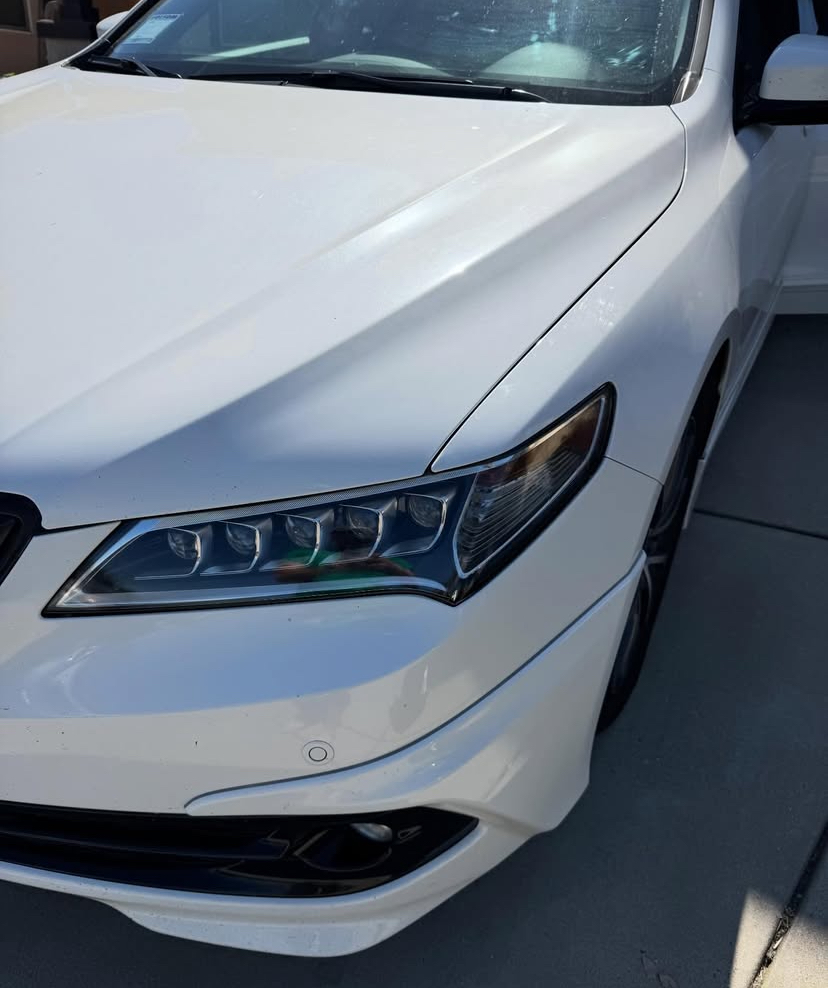White Acura — full car
